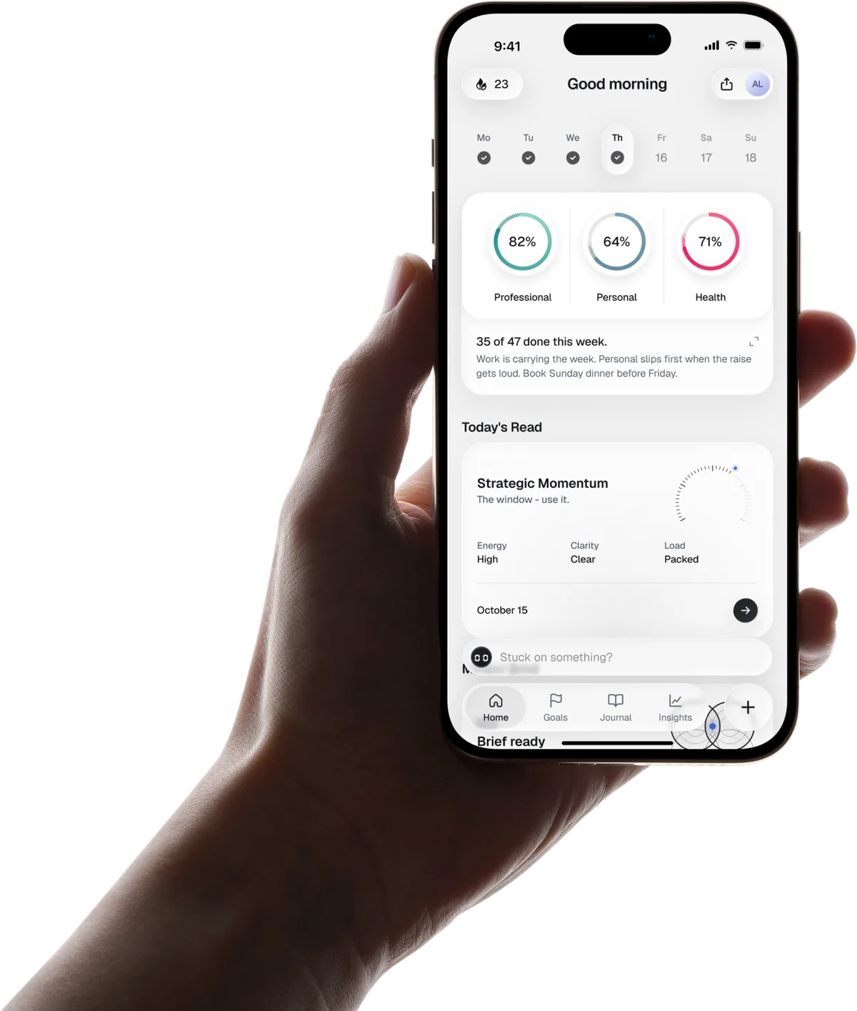 A hand holding an iPhone with the FocusPilot Home screen: three goal rings at 82, 64 and 71 percent and 35 of 47 tasks done this week